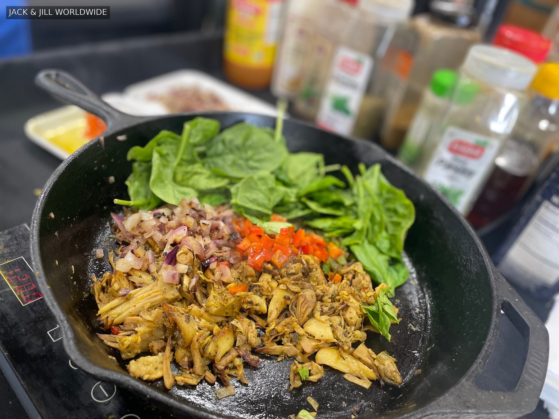 A bowl of prepared food and greens
