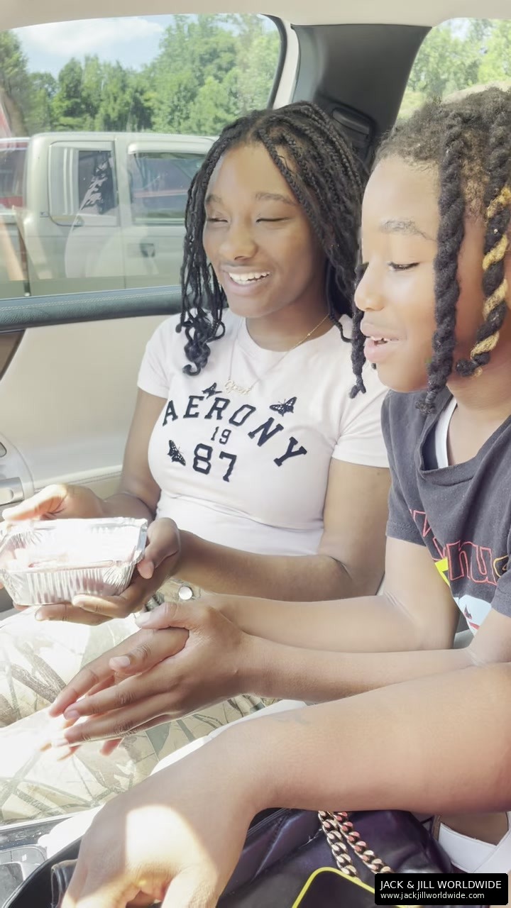 Two girls sharing Jack & Jill Watermelon Fries in a car