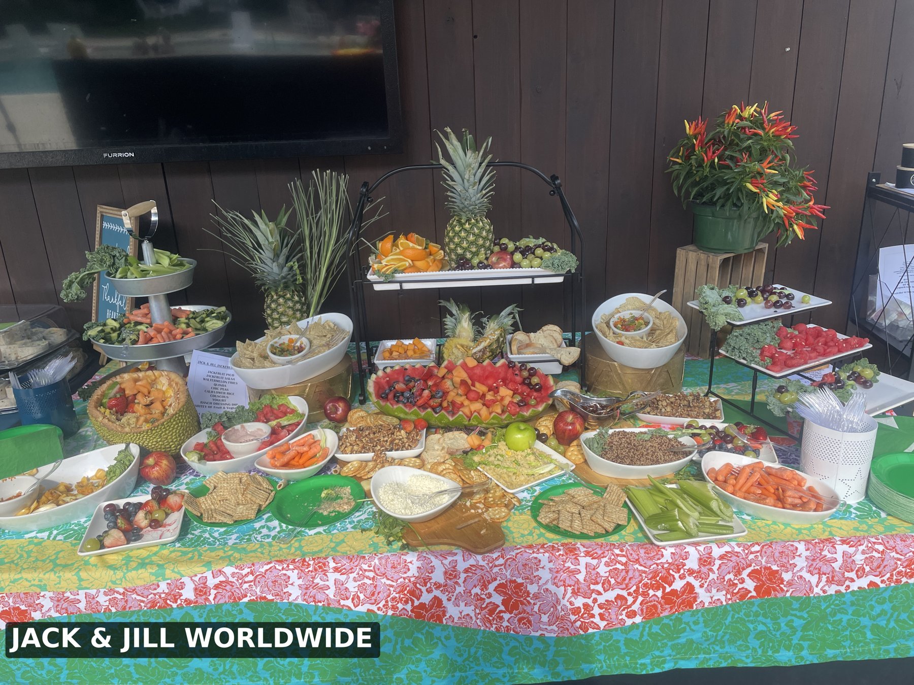 A colorful food display at a Jack & Jill Worldwide table